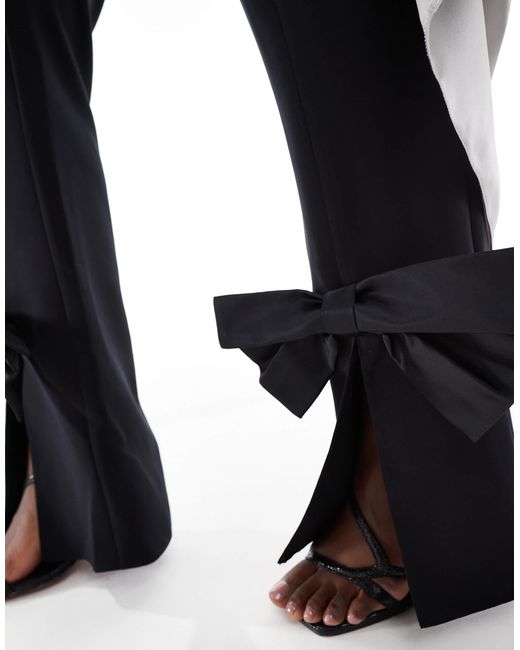 Curve - pantalon d'ensemble ajusté avec nœud en satin ASOS en coloris Black