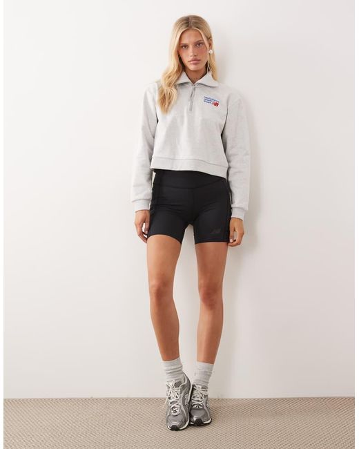 New Balance Natural Athletics Premium Logo Relaxed Fit Cropped Quarter Zip Top