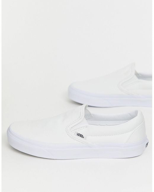 white platform vans slip on