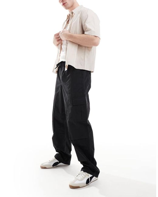 Pantalones Cargo Negros Holgados Sin Cierres De ASOS de hombre de color White