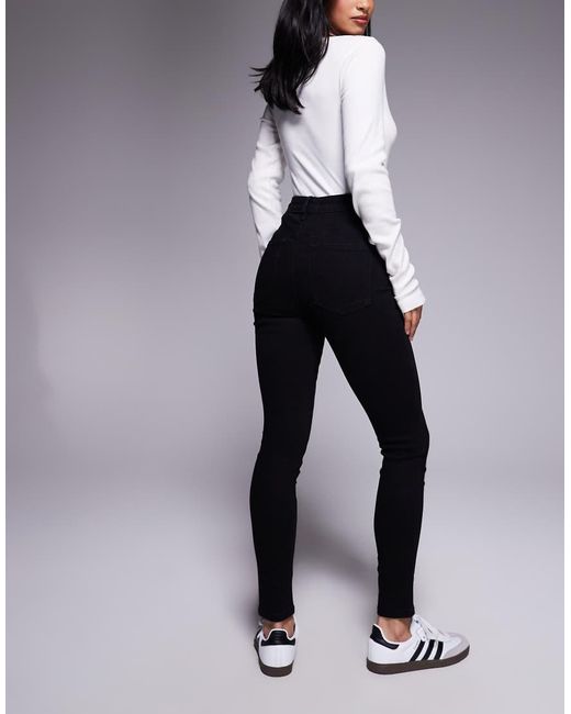 Vaqueros Negros De Corte Pitillo De Asos Design Petite ASOS de color Black