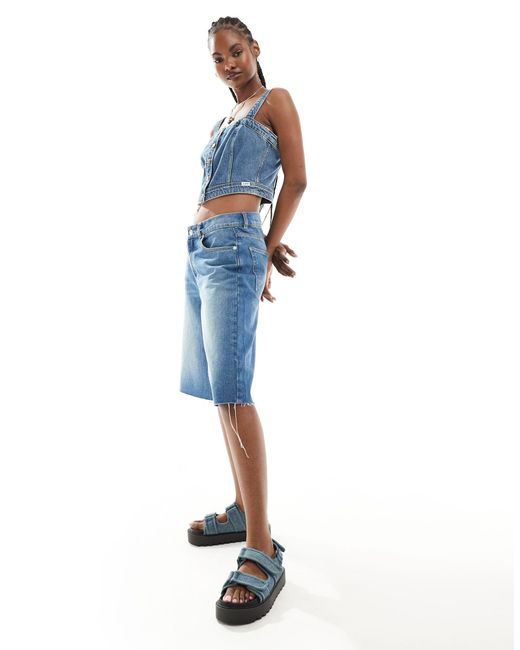 Top a corsetto di jeans lavaggio scuro con bottoni sul davanti di Lee Jeans in Blue