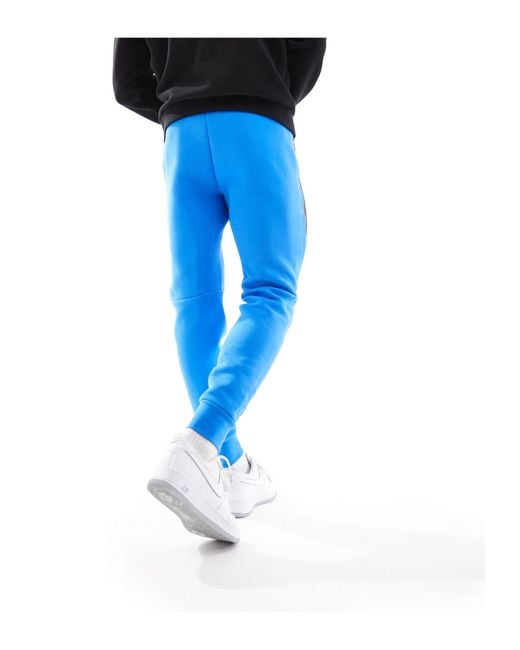 Joggers azules tech fleece Nike de hombre de color Blue