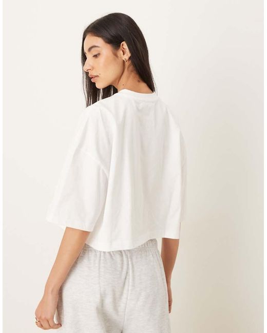 Calvin Klein Gestreepte Crop Top Met Rechte Pasvorm En Logo in het White