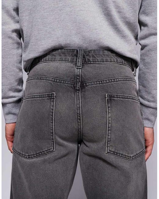 Vaqueros De Corte Tapered Con Lavado Tintado De ASOS de hombre de color Gray