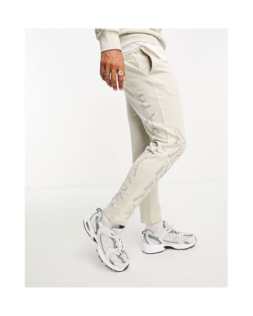 Joggers mix and match beige chiaro con logo scomposto di Armani Exchange in White da Uomo