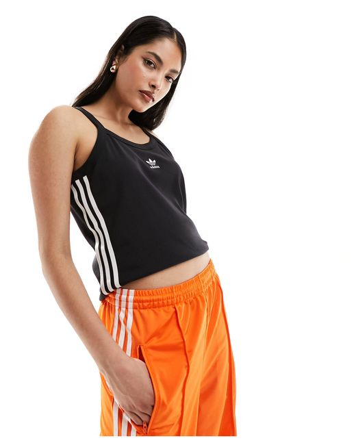 Top senza maniche con tre strisce di Adidas Originals in Orange