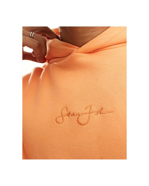 Felpa con cappuccio con scritta stampata sul petto di Sean John in Orange da Uomo