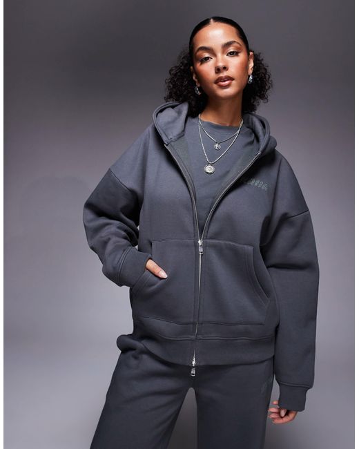 Sweat à capuche d'ensemble zippé en coton majoritaire à logo orné Kaiia en coloris Blue