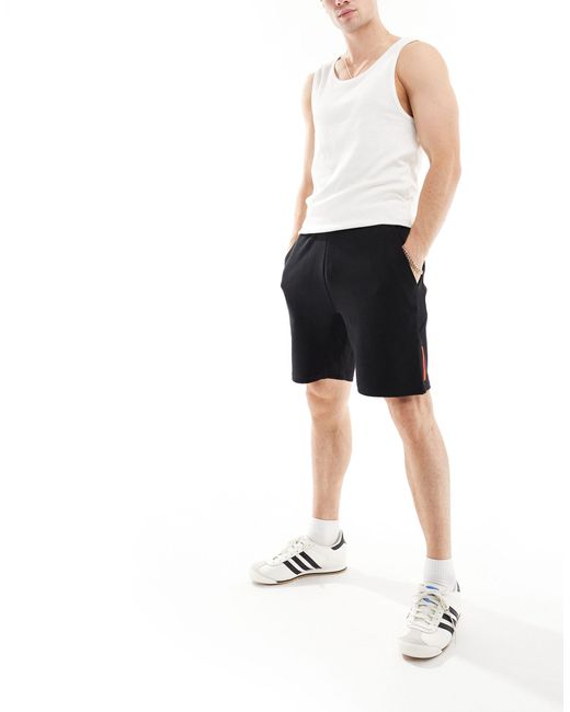 Superdry – sport – schmal zulaufende, funktionale shorts in Black für Herren