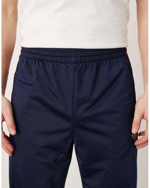 Adidas Originals Blue Firebird Track Pants for men
