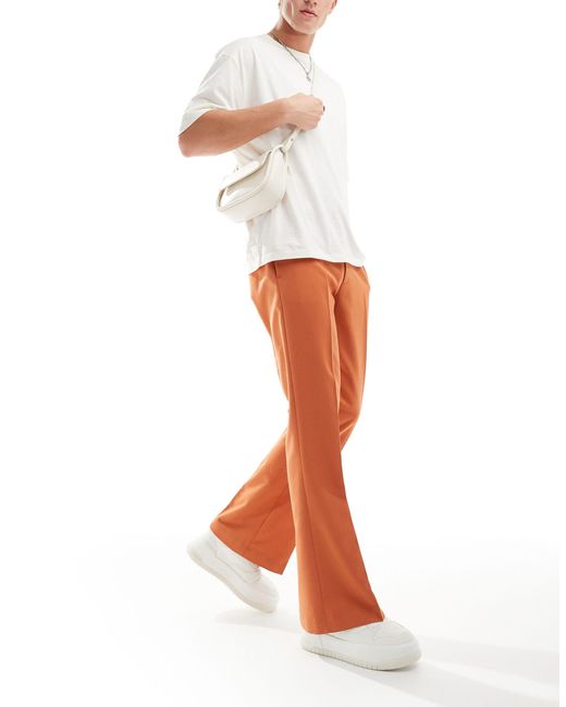 Pantaloni a zampa eleganti arancioni di ASOS in White da Uomo