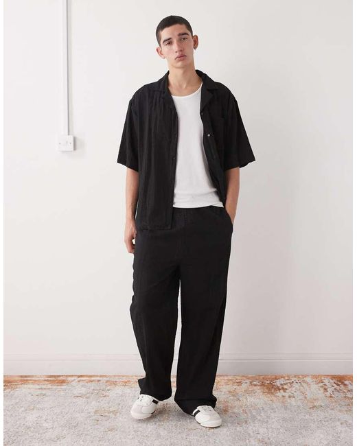 Pantaloni Neri Testurizzati di Collusion in White da Uomo