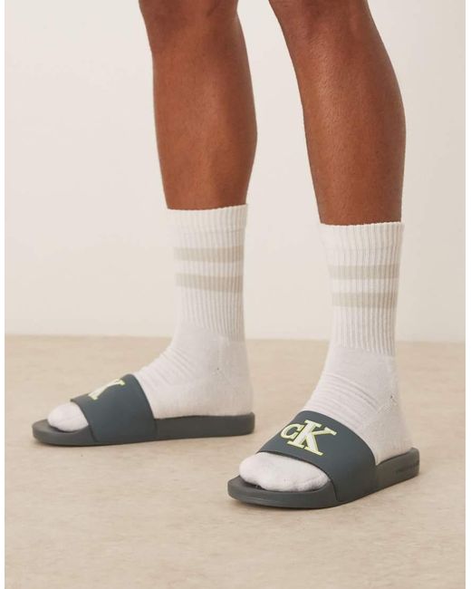 Sliders-Azzurro Lime E Bianche Con Logo Grande di Calvin Klein in Natural da Uomo
