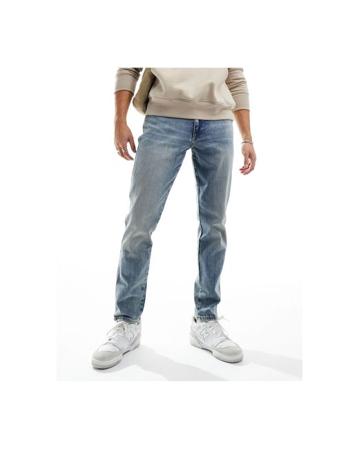 Jean ajusté - clair River Island pour homme en coloris Blue