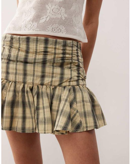 Minigonna Color Latticello A Quadri Con Vita Scesa di Collusion in Natural