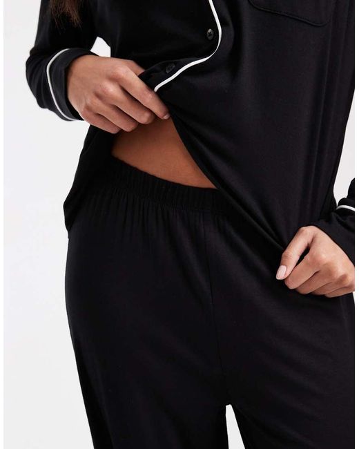 ASOS Black Asos Design Petite Super Soft Long Sleeve Shirt & Pants Pyjama Set With Contrast Piping