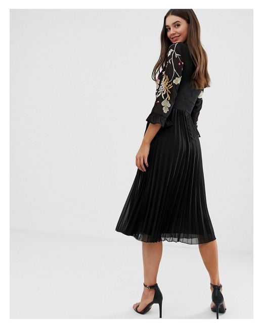 embroidered pleated midi dress with fluted sleeve