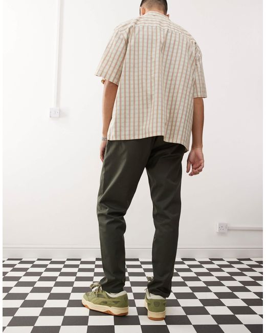 Dr. Denim Green Rush Tailored Tapered Leg Chino Pant With Elastic Waistband And Drawstring for men