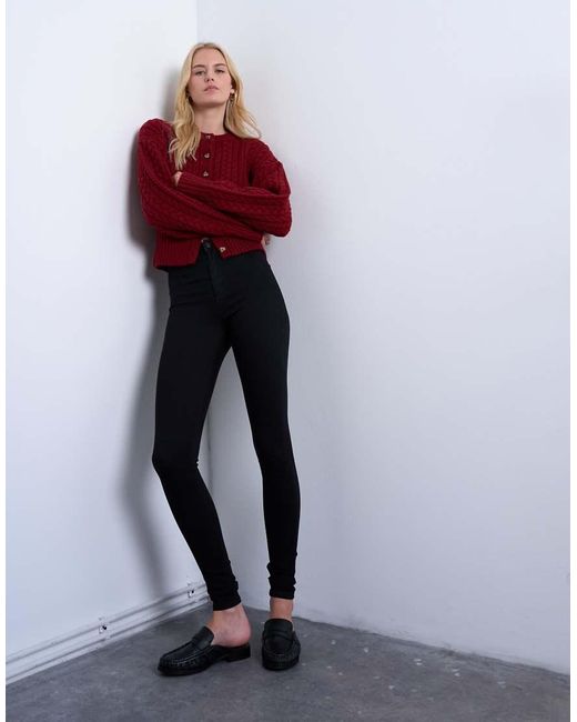 Vaqueros Negros De Corte Superpitillo Y Talle Alto Joni De TOPSHOP de color Black