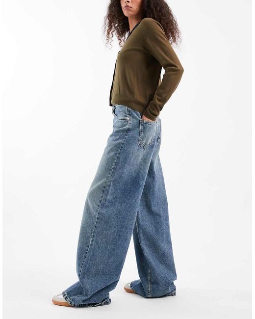 Vaqueros De Pernera Ancha Y Talle Alto Con Lavado Y Detalle De Tira Ajustable De -Azul ASOS de color Blue