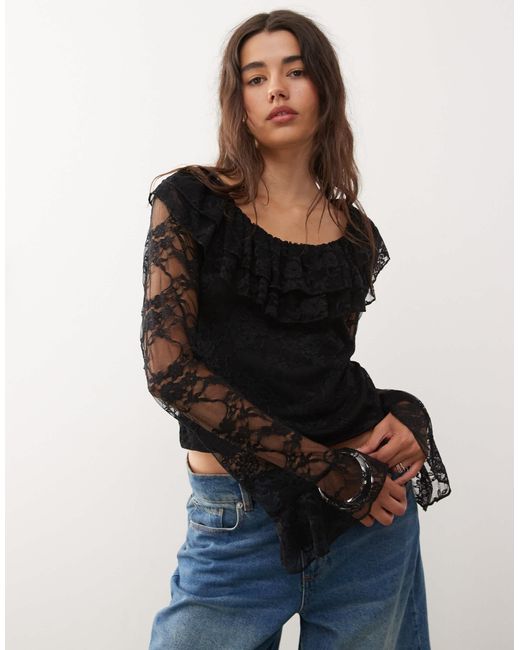 Top en dentelle avec manches anges longues et encolure à volants - noir Reclaimed (vintage) en coloris Black