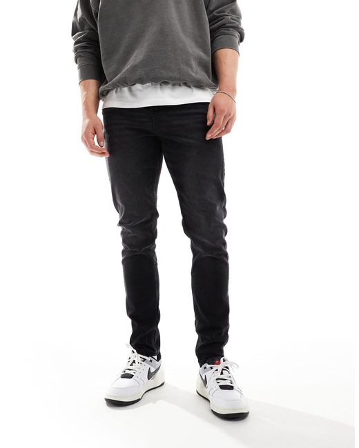 Jeans skinny délavé di ASOS in Gray da Uomo