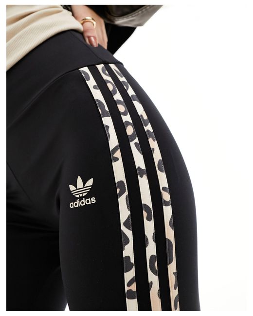 Leopard luxe - leggings a zampa neri con tre strisce leopardate di Adidas Originals in Black