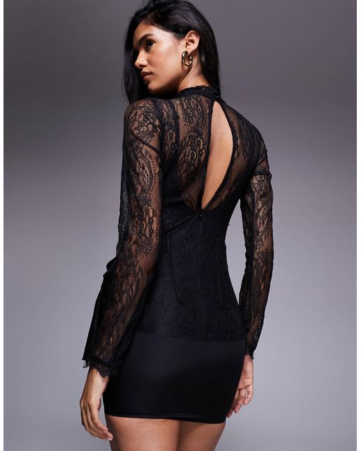 Robe courte à col montant et manches longues en dentelle avec jupe à superposition drapée ASOS en coloris Black