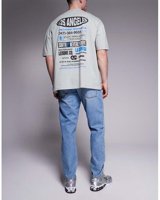 Vaqueros Tapered Azules Con Lavado Claro De ASOS de hombre de color Blue