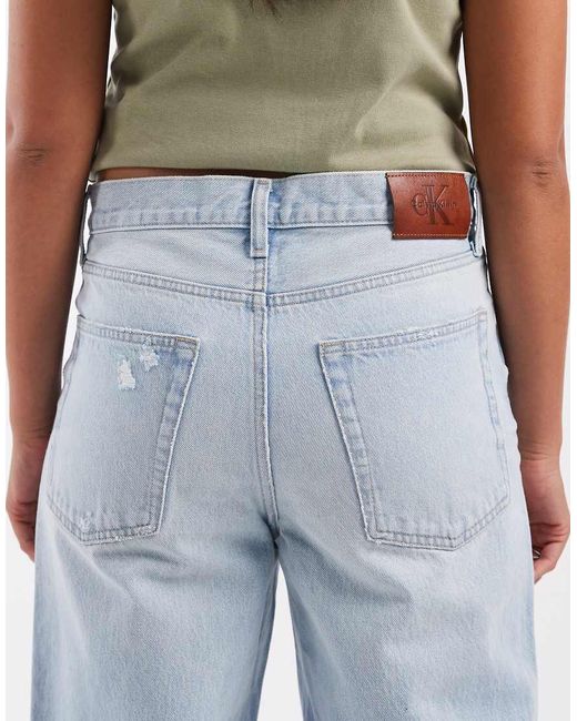 Calvin Klein Blue Low Rise Baggy Jeans With Rip Details