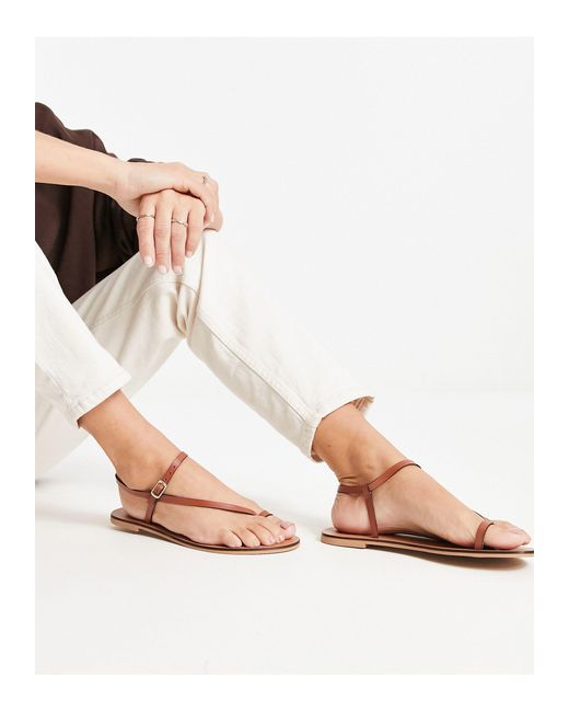 Flat sandals with store toe loop