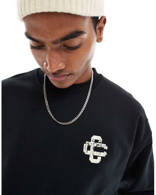 The Couture Club Black Cracked Print Emblem Sweatshirt for men