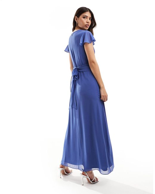 L'invitée - robe longue style cache-cœur - aster TFNC London en coloris Blue