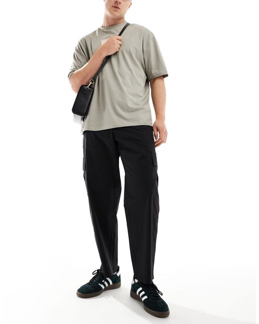 Pantalon cargo ample SELECTED pour homme en coloris Black