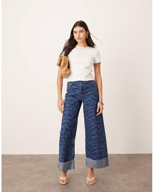 Parker - jean ample à taille haute et revers avec imprimé tigré - bleu ARRANGE en coloris Blue