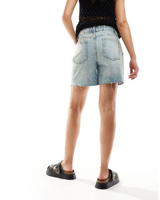 Short en jean coupe dad à taille croisée - moyen délavé ASOS en coloris Blue