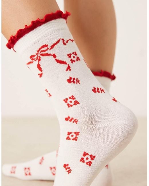 Accessorize Sokken Met Rode Strikjes in het Natural
