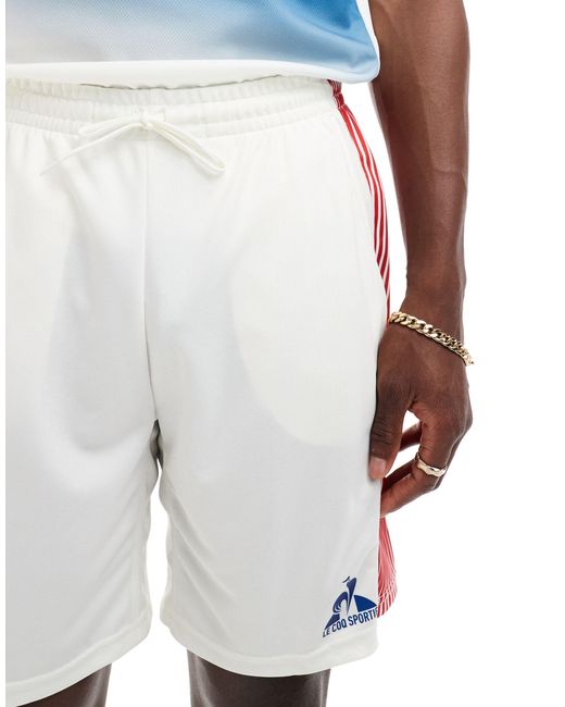 Pantalones cortos blanco con diseño del equipo francés para los juegos Le Coq Sportif de hombre de color Blue