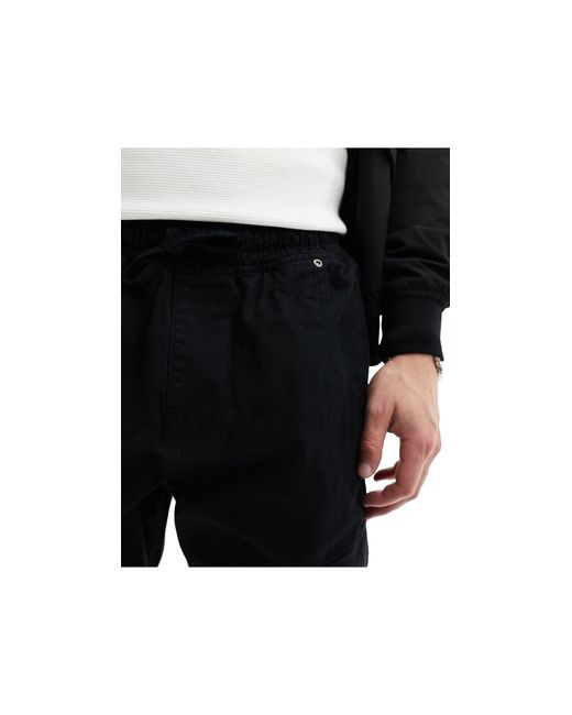 Pantaloni cargo neri con fondo elasticizzato di Another Influence in Black da Uomo