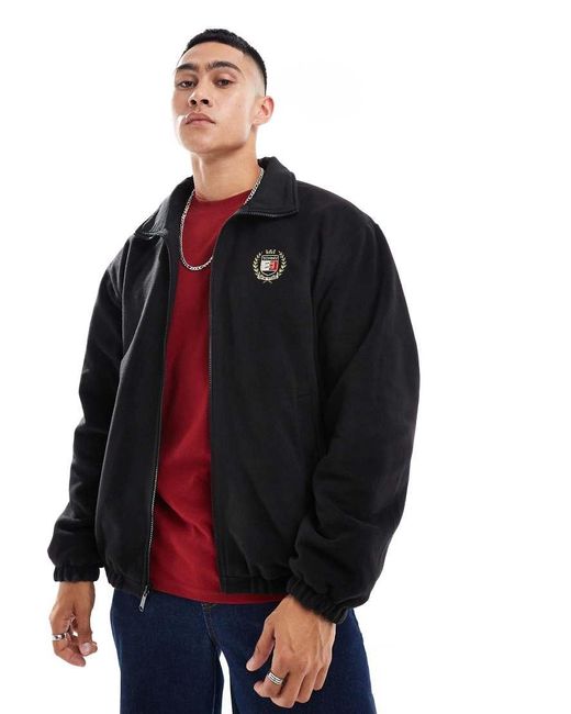 Chaqueta Negra Reversible Con Detalle De Escudo De Tejido Tipo Peluche De Tommy Hilfiger de hombre de color Blue