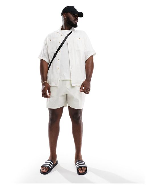 Pantaloncini da bagno di lunghezza media di ASOS in White da Uomo