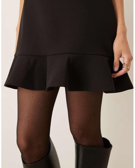 Mango Hoogsluitende Mouwloze Mini-Jurk Met Structuur En Peplumzoom in het Black