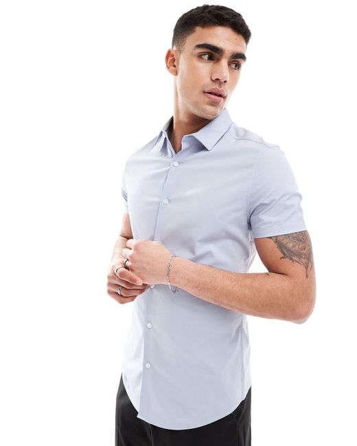 Camicia skinny con maniche risvoltate azzurra di ASOS in White da Uomo
