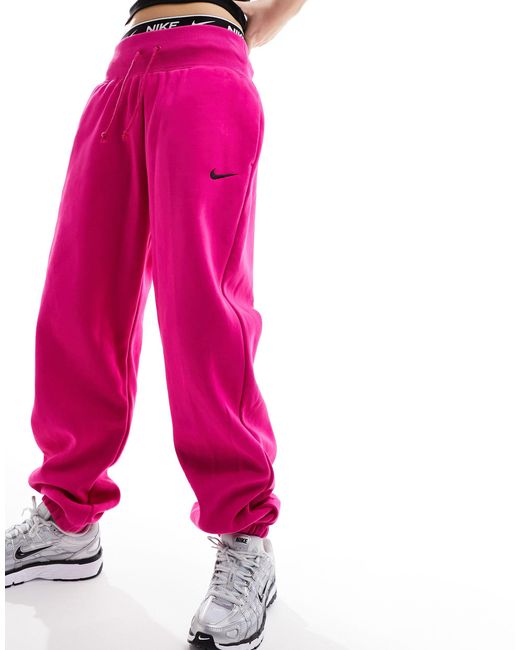 Nike Mini Swoosh Oversized Fleece joggers in Pink Lyst