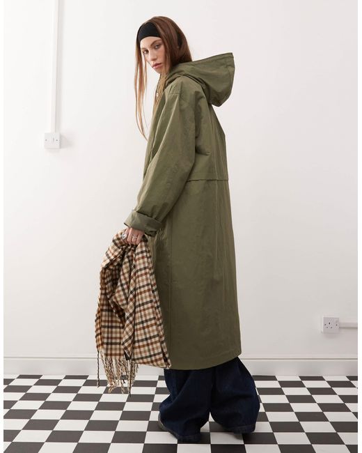 Collusion Green – longline-trenchjacke