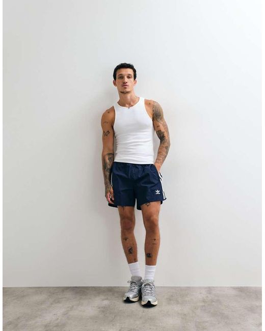 Adidas Originals Blue Adicolor Polyester 3 Stripe Shorter Shorts for men