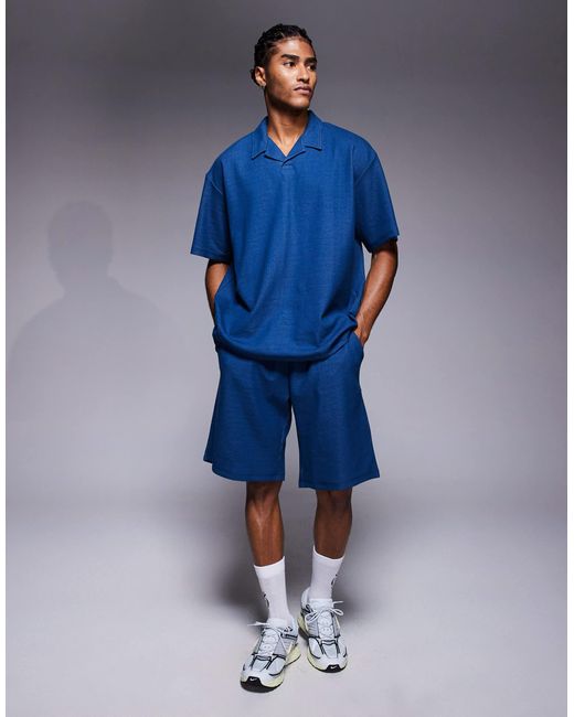 ADPT Blue Split Neck Texture Polo Shirt for men