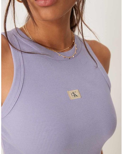 Calvin Klein Geribbelde Tanktop Met Geweven Label in het Purple