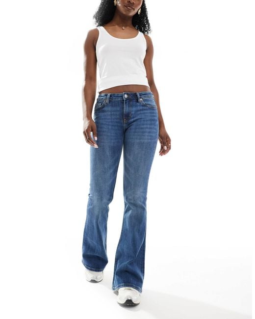 Katsumi - jean évasé à taille basse - délavé Monki en coloris Blue